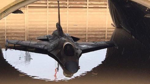 An F-16 jet in a flooded hangar at Hatzor Airbase ()